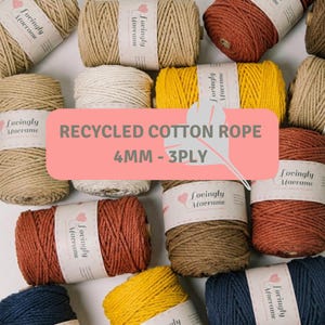 May include: Multiple spools of 4mm 3-ply recycled cotton rope in various colors including beige, yellow, rust, and navy blue. Each spool features a white paper label with the text Lovingly Macrame. The text RECYCLED COTTON ROPE 4MM - 3PLY is visible.