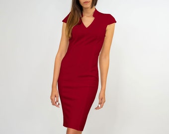 Fitted ruby red dress with open back and V-neckline. Cap-sleeves stretch dress.