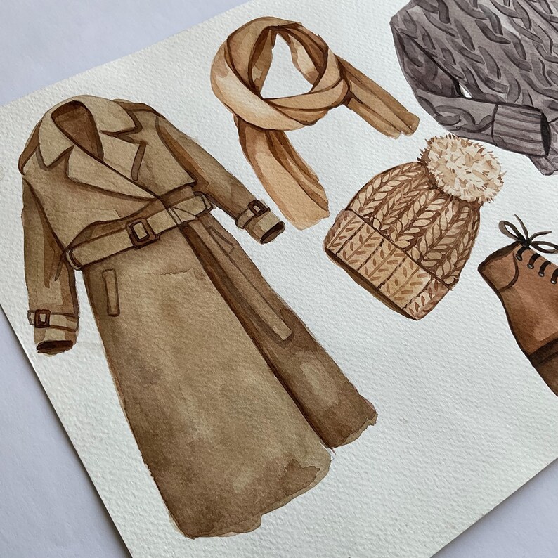 Puede incluir: Una ilustraci&oacute;n de acuarela de una gabardina marr&oacute;n, un gorro de punto marr&oacute;n con un pomp&oacute;n, una bufanda marr&oacute;n, una bota de cuero marr&oacute;n y un su&eacute;ter de punto gris.