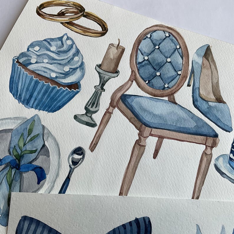 May include: Watercolor illustration of wedding details, including a blue cupcake with white frosting, a blue chair with a brown frame, a pair of gold rings, a blue high heel shoe, and a candle holder.