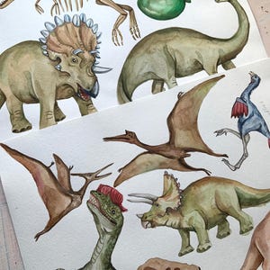 May include: Watercolor painting of various dinosaurs, including a triceratops, a stegosaurus, a pterodactyl, and a velociraptor. The painting also includes a fossilized ammonite and a green balloon.