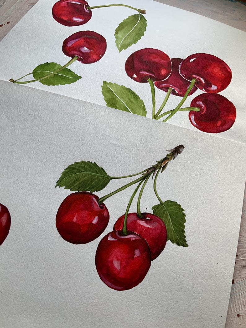 May include: Watercolor painting of red cherries with green leaves. The cherries are arranged in two clusters, one with four cherries and the other with three cherries.