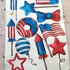 May include: Watercolour illustrations of various red, white and blue patriotic themed items, including stars, fireworks, a doughnut, a bow, a popsicle, and balloons.