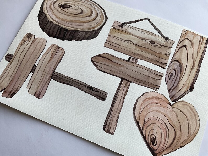 K&ouml;nnte beinhalten: Ein Set aus sechs Aquarell-Illustrationen von Holzschilden und Baumrundlingen. Die Schilder sind in verschiedenen Formen und Gr&ouml;&szlig;en, darunter eine Herzform. Die Baumrundlinge haben ein nat&uuml;rliches Holzmaserungsmuster. Die Illustrationen sind in Braun- und Beiget&ouml;nen gemalt.