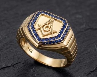Anillo de sello masónico de oro macizo de 14 quilates con piedras preciosas de zafiro azul.