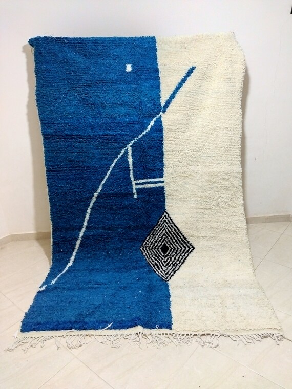 Traditional handmade carpet, woven from natural wool in blue, white and black color, Azilal carpet