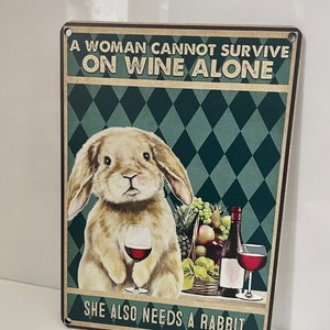 Poster Sign Funny Rabbit “A woman cannot survive on wine alone” she also needs a rabbit. Home Decor Outdoor Indoor Plaque Signs