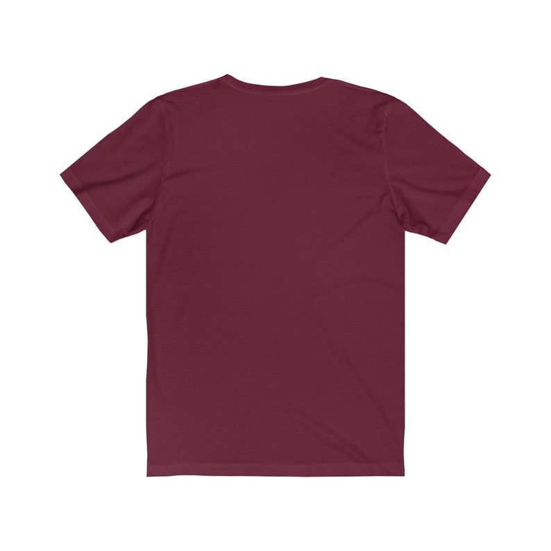 May include: A plain maroon short-sleeved t-shirt.