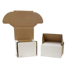 May include: Two cardboard boxes with white interiors. The box on the left is open and the lid is folded back. The box on the right is closed with the lid folded down.