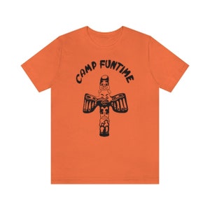 May include: Orange t-shirt with a black graphic of a totem pole with the text "Camp Funtime" above it.