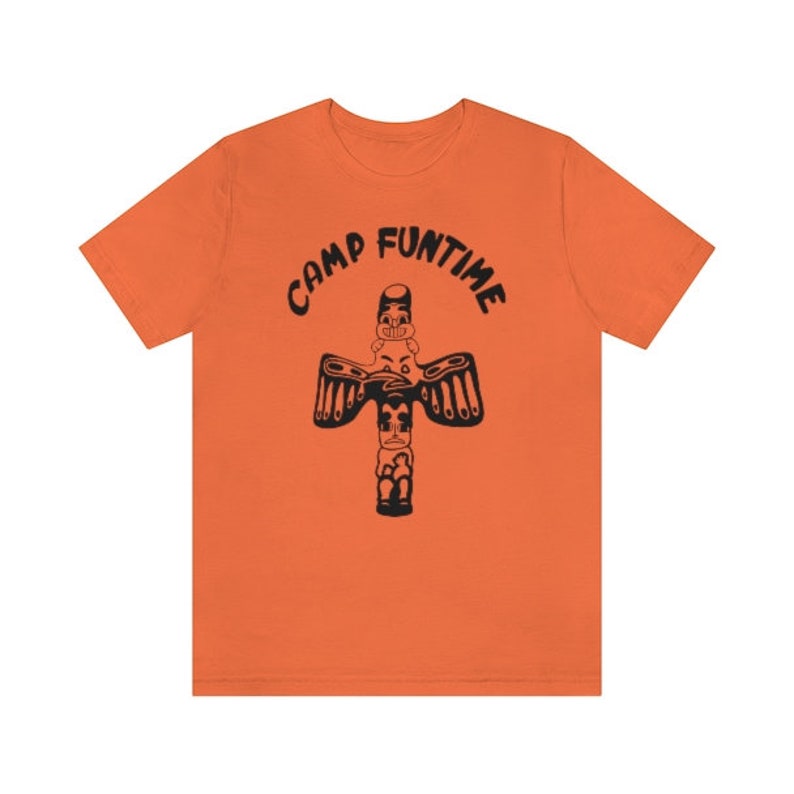 May include: Orange t-shirt with a black graphic of a totem pole with the text "Camp Funtime" above it.