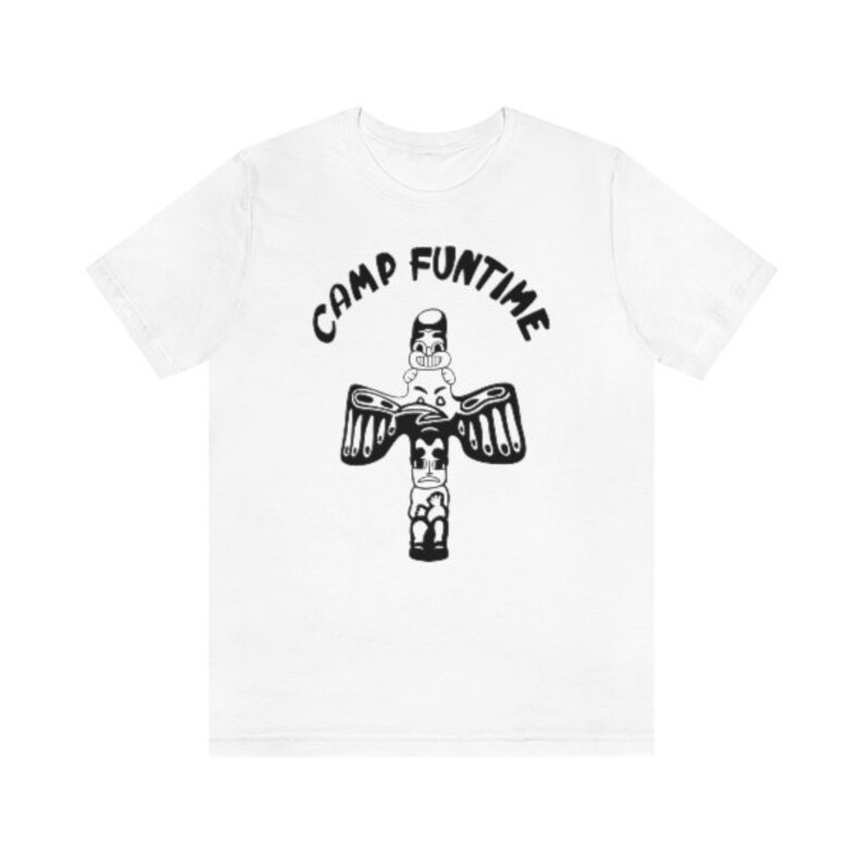 May include: White t-shirt with a black and white graphic of a totem pole with the text "Camp Funtime" above it.