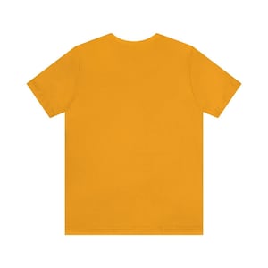 May include: A plain, solid yellow short-sleeved t-shirt.