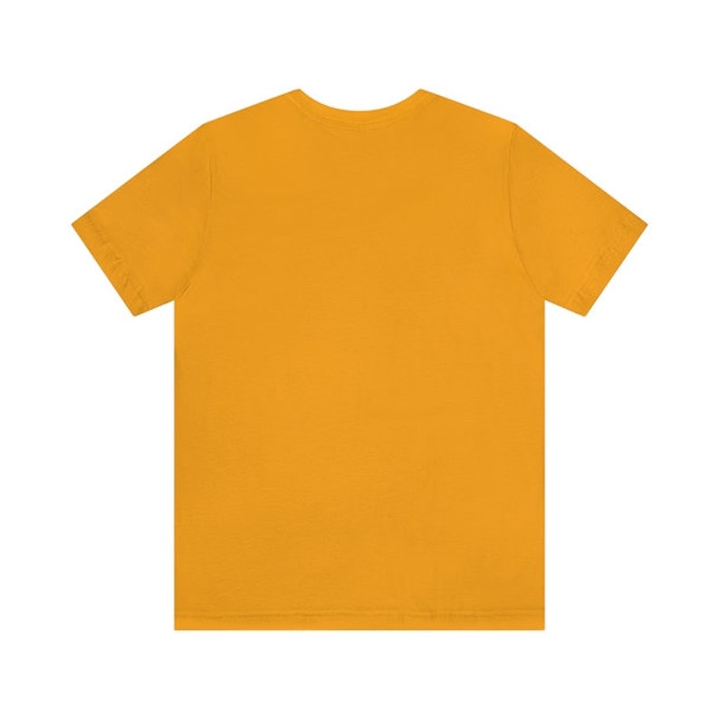 May include: A plain, solid yellow short-sleeved t-shirt.