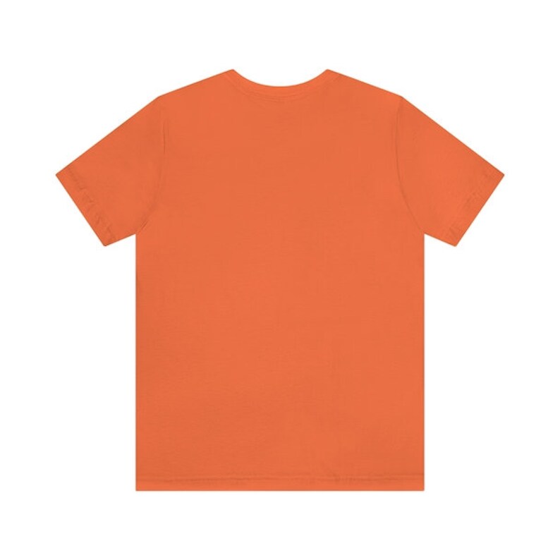 May include: A plain orange short-sleeved t-shirt.