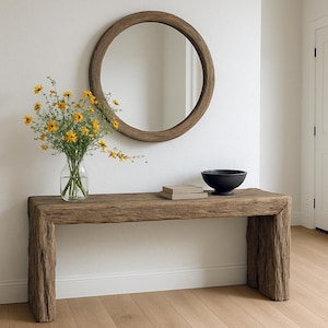May include: A rustic wooden sign with the text "Welcome to our home" in white lettering. The sign has a distressed finish and a simple, inviting design, ideal for entryway decor.