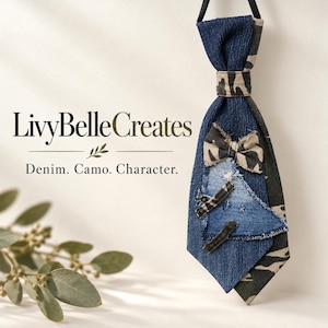 May include: A necktie featuring a combination of blue denim and camouflage fabric. The tie includes a small camouflage bow accent, frayed denim patches, and the text LivyBelleCreates Denim. Camo. Character. printed on the left side.