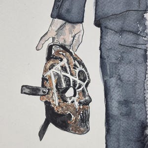 May include: Watercolor painting of a mask held by a person in a dark suit. The mask is brown and black with a skeletal design and metal accents. The person's hand is visible, holding the mask. The background is a plain white.