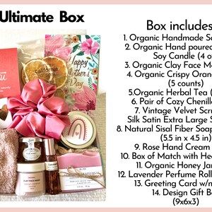 May include: A pink and white gift box filled with various self-care items, including a pink soap bar, a jar of honey, a bottle of lavender perfume, a pink face mask, a pink towel, a pink scrunchie, a pair of socks, a tea bag, and a card that says "Happy Mother's Day". The box also includes a small bag of orange slices and a small bag of herbal tea. The box is labeled "Ultimate Box" and includes a list of all the items included.
