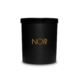 May include: Black candle jar with a gold "NOIR" label.