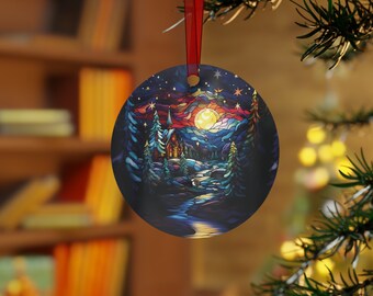 May include: Round Christmas ornament featuring a stained glass style image of a small cabin in a snowy forest with a full moon and stars in the sky.