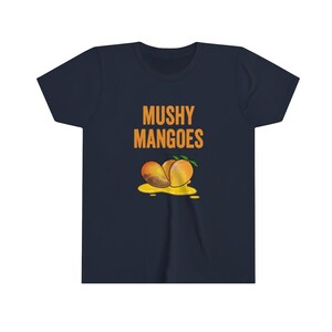 May include: A navy blue youth t-shirt with the text "Mushy Mangoes" in orange letters. A cartoon image of three mangoes is below the text.
