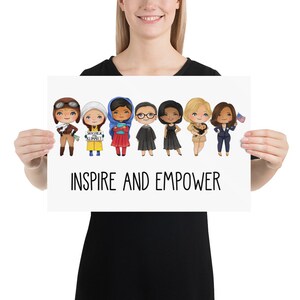 May include: A white poster with a line of eight cartoon women, each with different hairstyles and outfits. The women are holding objects like books, a flag, and a sign that says "Because I'm a Girl". The poster has the text "Inspire and Empower" at the bottom.
