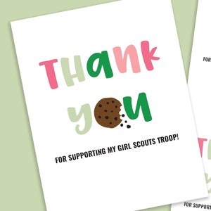 May include: White cards with the words "Thank You" in pink, green, and light green, along with a chocolate chip cookie graphic. The text "FOR SUPPORTING MY GIRL SCOUTS TROOP!" is below. The image is on a light green background.