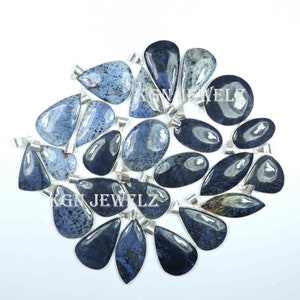 May include: A collection of 17 blue and grey gemstone pendants with silver bail settings. The pendants are teardrop shaped and have a speckled pattern.