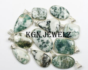 May include: A collection of 10 green and white moss agate pendants with silver bezels. The pendants are various shapes and sizes, including oval, teardrop, and rectangular.