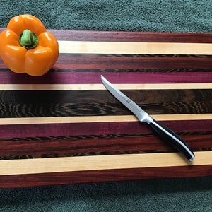 Dark Beautiful Wenge Beveled Edge Cutting Board Accented With Paduak, Maple, and Purple Heart