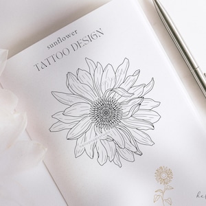 May include: A black and white line drawing of a sunflower tattoo design. The text "sunflower tattoo design" is written above the sunflower.