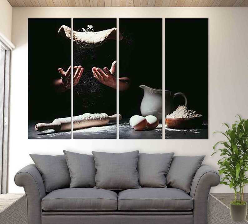 May include: A multi-panel canvas print depicting a chef tossing dough in the air, with flour flying around. The scene is set in a dark kitchen with a rolling pin, a bowl of flour, and eggs on the counter.