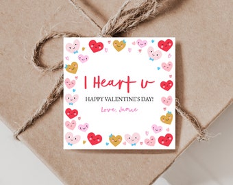 May include: A white card with a red heart border and the text "I Heart u" in red. The card also includes the text "Happy Valentine's Day! Love, Jamie" in black. The card is decorated with pink, red, and yellow hearts with faces.