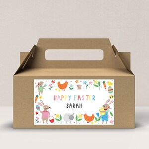 May include: A brown cardboard box with a handle, decorated with a colourful sticker featuring bunnies, chicks, flowers, and the text "Happy Easter Sarah".