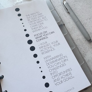 May include: A motivational quote about focusing on what you can control in life. The quote is written in black text on a white background with a series of black dots down the left side of the page.