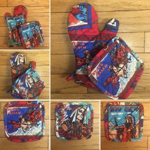 May include: Set of four quilted pot holders featuring a Native American theme. The pot holders are red, blue, and brown with images of Native American people, horses, and stagecoaches. The text "Stage Coach" and "Big Sky" are printed on the pot holders.