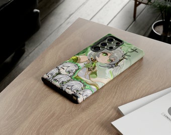 May include: A green, white, and black phone case with a cartoon character design. The case features a female character with green hair and a white dress. The text "ナギサ" is printed on the case.