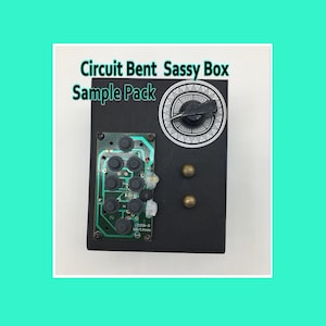 May include: A black box with a combination dial and brass-colored rivets. A circuit board with black buttons is attached to the front. The text "Circuit Bent Sassy Box Sample Pack" is displayed on the top.