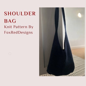 May include: A black knitted shoulder bag hanging on a white door. The bag is made with double knit or worsted weight yarn. The caption reads "Shoulder Bag Knit Pattern By FoxRedDesigns What you will need: 2x stein of double knit or worsted weight yarn 3.5mm needles Stitch markers"