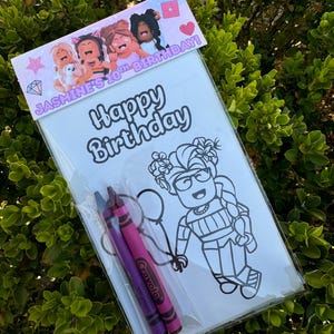 May include: A white coloring page with a cartoon girl holding balloons. The page is in a clear plastic bag with two purple and pink crayons. The bag has a pink and purple banner at the top that says "Jasmine's 10th Birthday!" and "Happy Birthday".