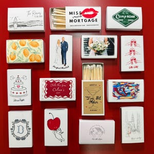 a red wall covered in lots of different types of cards