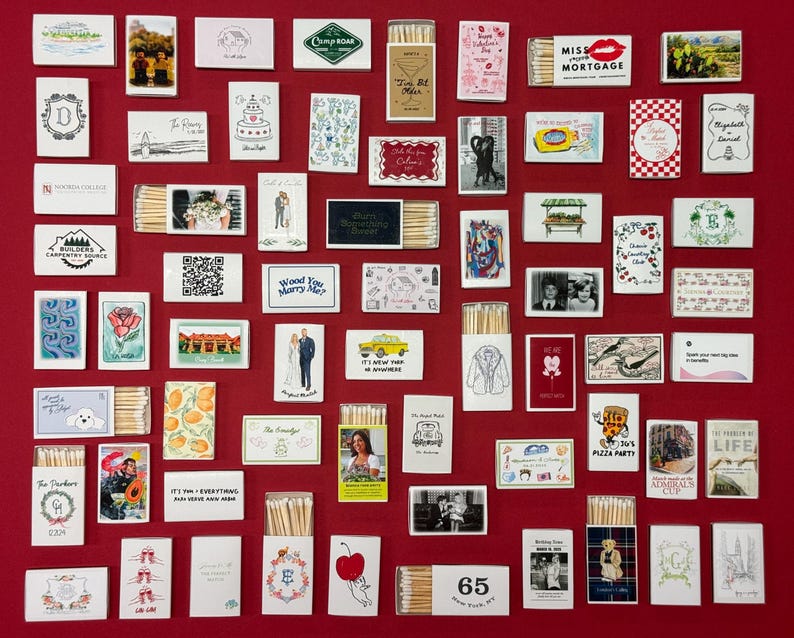 a red wall covered in lots of different types of cards