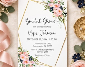 May include: A rectangular bridal shower invitation card featuring a gold geometric frame, watercolor pink roses, and dark blue berries. The text reads: Bridal Shower, Join us in celebrating Hope Johnson, SEPTEMBER 11, 20XX | 4:00 PM, 202 Woodside Lane, Sacramento, CA 95691, RSVP to Cindy by September 1 502-123-4567, Registered at Target.