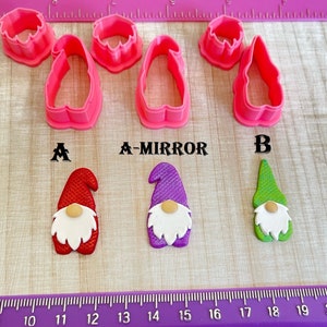 May include: Three gnome cookie cutters, one with a mirror image, and three finished gnome decorations in red, purple, and green.