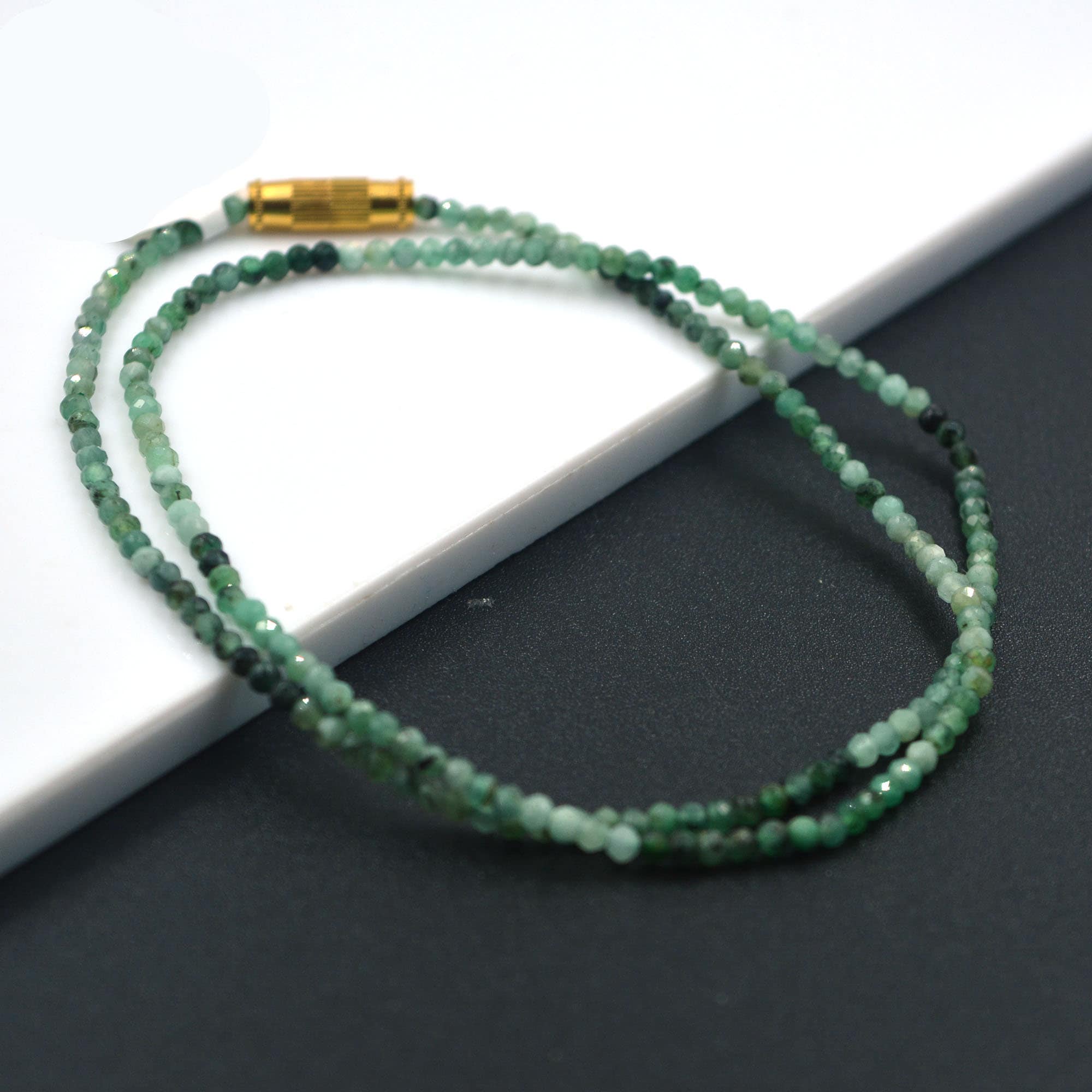 ADELBERT. Collier de perles triple rangs à fermoir or. 18K. - Lot