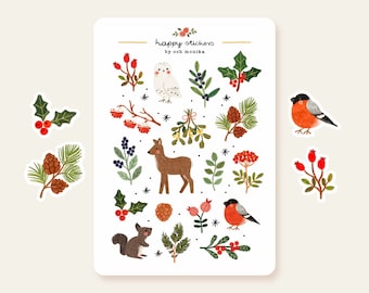 May include: A sheet of stickers featuring winter-themed illustrations, including a deer, a squirrel, a bird, a pine cone, holly, berries, and a snowy owl. The stickers are on a white background with the text "happy stickers by ooh monika".