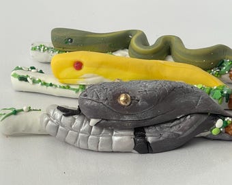 Reptile party favors | chocolate covered pretzels with edible Fondant snake design