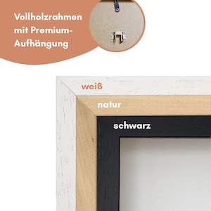 Puede incluir: Primer plano de un marco de fotos con borde blanco, de madera natural y negro. El marco tiene el texto "wei&szlig;", "natur" y "schwarz". El marco es de madera y tiene un sistema de colgado premium.