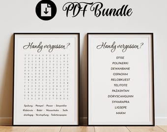 May include: Two framed prints with black frames. The left print has a word search puzzle with German words. The right print has a list of German words. Both prints have the text "Handy vergessen?" at the top.